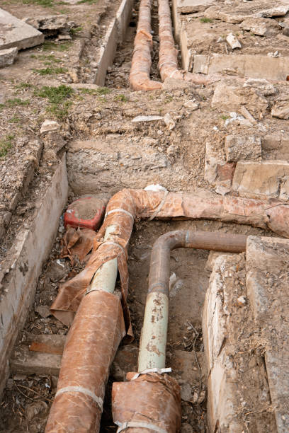 istock Abandoned water pipes in ditch 665623904