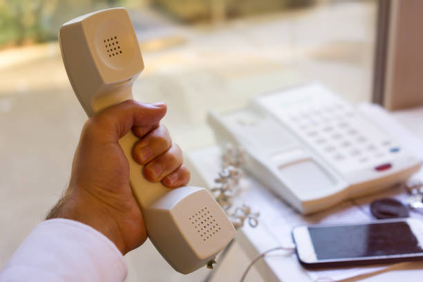 Businessman holding a phone in office