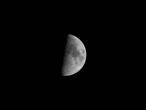 Half Yellow Moon On Black Background Stock Photo - Download Image