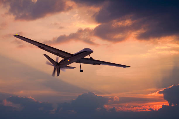 Drone flying on the sky Unmanned aerial vehicle (UAV) flying on the sky unmanned aerial vehicle stock pictures, royalty-free photos & images