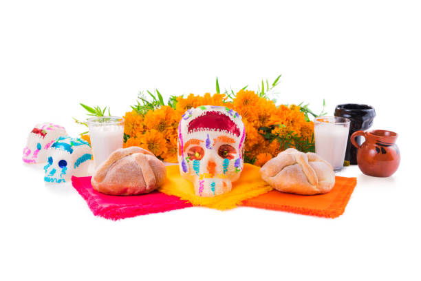 Sugar Skull used for altars at "dia de los muertos" in Mexico sugar skull used for "dia de los muertos" celebration isolated on white with cempasuchil flowers altar photos stock pictures, royalty-free photos & images