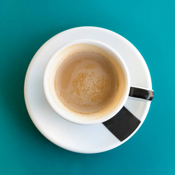 istock Cup of coffee on turquoise with copyspace 665634554