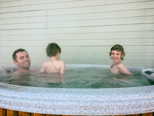 istock Hot tubbing after skiing with dad 665641212