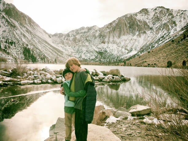 istock Brothers hugging in the mountains 665641226