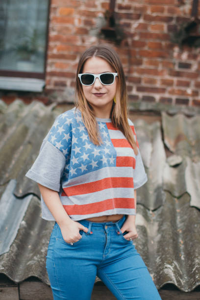 istock A hipster girl in an old courtyard posing and smiling 665641620