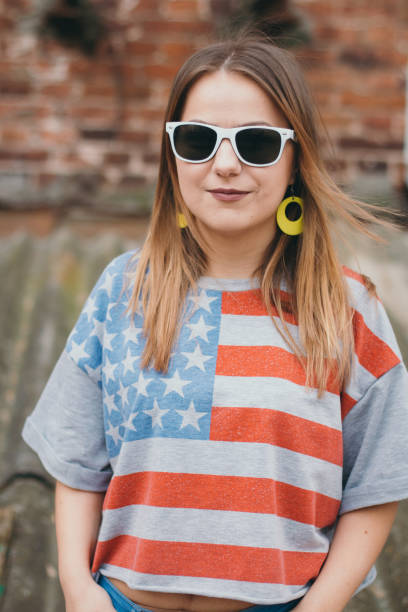 istock A hipster girl in an old courtyard posing and smiling 665643926