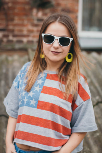 istock A hipster girl in an old courtyard posing and smiling 665643970