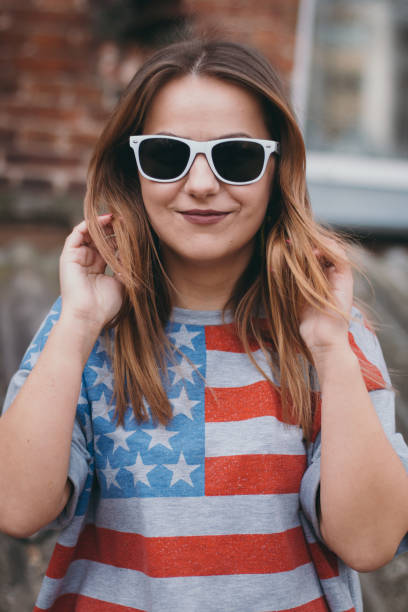 istock A hipster girl in an old courtyard posing and smiling 665644184