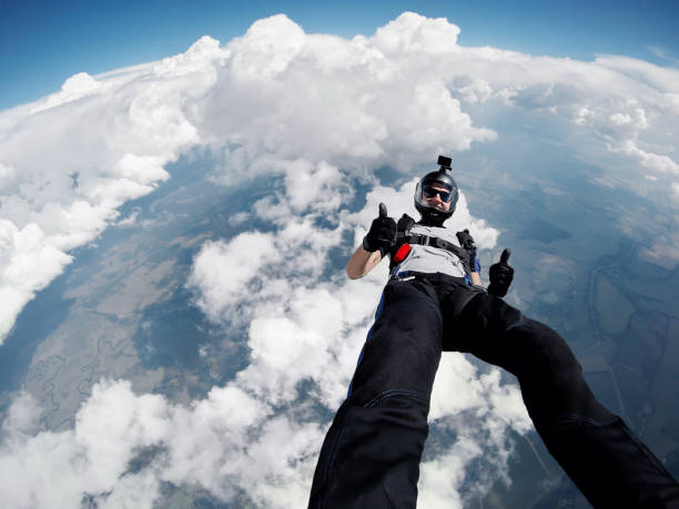 istock Skydiver self portrait above the clouds 665644254