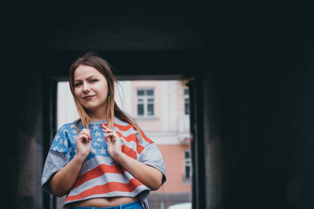 istock A hipster girl in an old courtyard posing and smiling 665648494