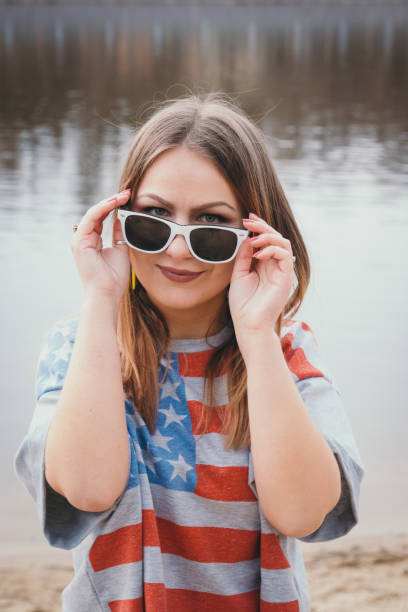 istock A girl hippy on the river bank posing and smiling 665653334