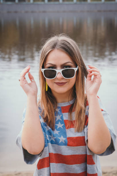 istock A girl hippy on the river bank posing and smiling 665653414