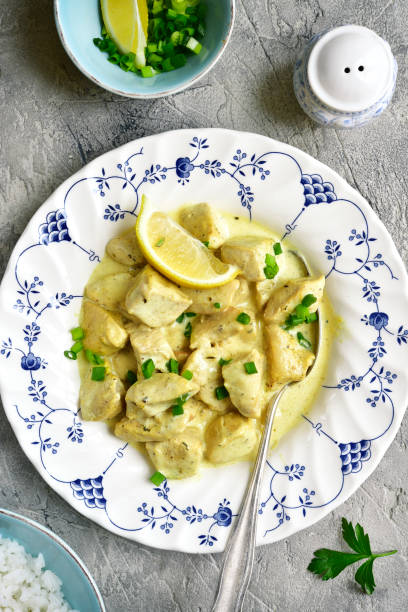 istock Chicken fricassee in a white sauce garnished with boiled rice 665656022