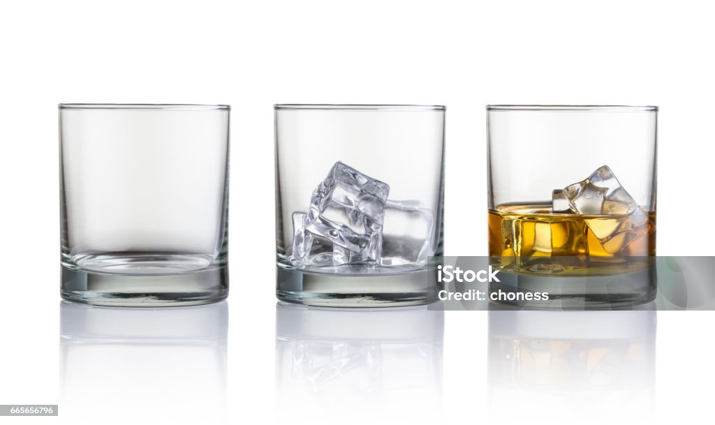 whiskey Empty glass, glass with ice cubes and glass with whiskey and ice cubes. Isolated on white background Drinking Glass Stock Photo