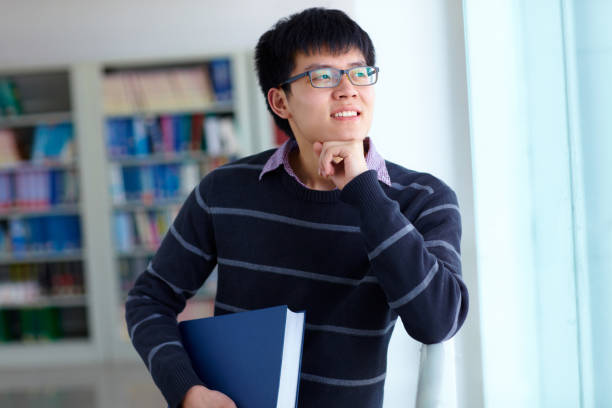 istock One young asian college student study in the library 665660274