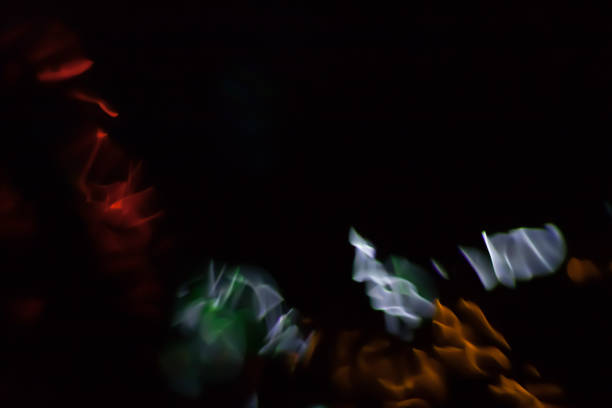 istock Abstract blurred colorful light on black backgrpound. Multicolor vivid reflections on the water. Cosmic, space and biological. 665665926