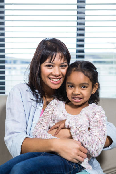 istock Happy mother embracing her daughter 665667052