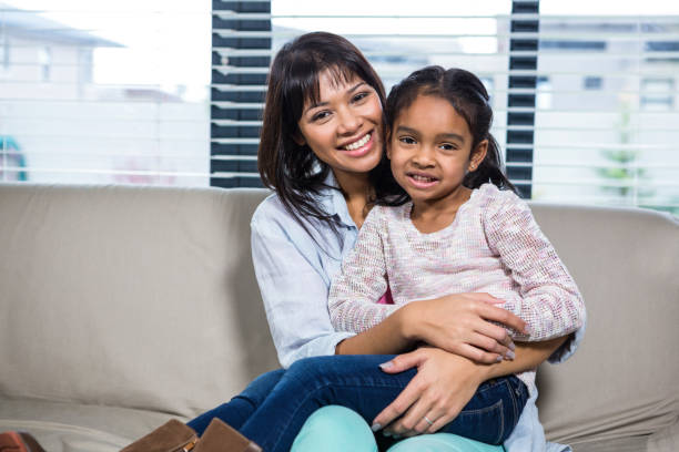 istock Happy mother embracing her daughter 665667122