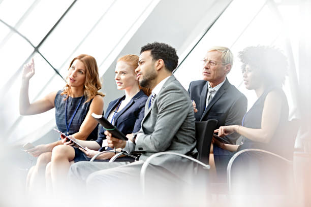 istock business woman  asking question in seminar 665669762