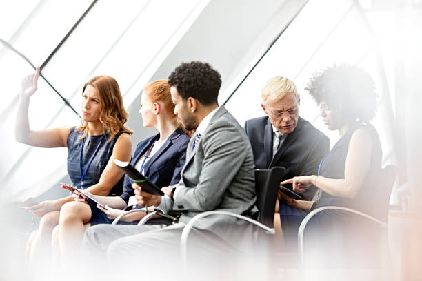 istock business woman  asking question in seminar 665669816