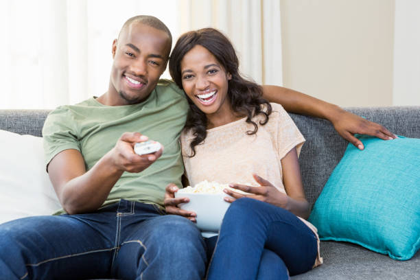 istock Young couple relaxing on the sofa 665670690