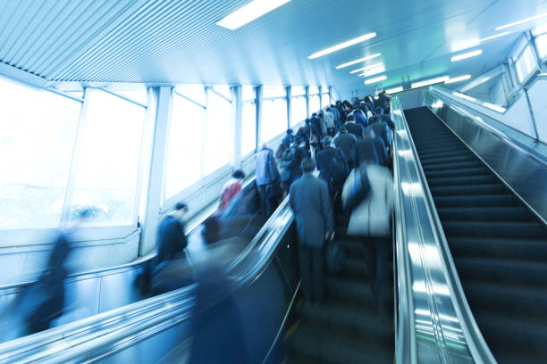 istock City Commuters on Escalator at the Station 665678324
