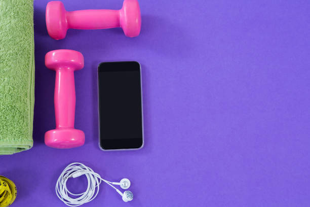 istock Dumbbells, towel, mobile phone with headphones 665681248