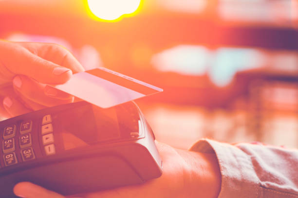istock Woman paying with a credit card. 665681370