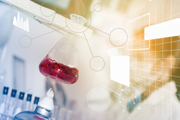 istock Flask in scientist hand with test tubes for analysis. 665692696