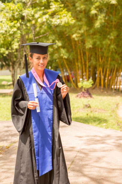 istock Graduating Lady Showing her Medal 665693060