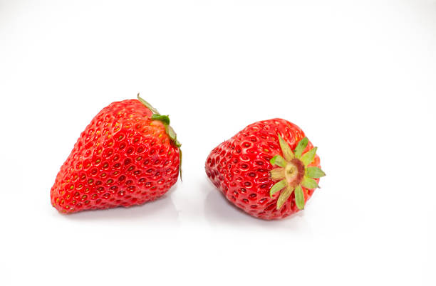 istock Two strawberry on the white background 665695936
