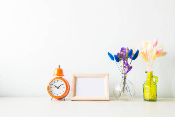istock Indoor plant in a white ceramic pot on old wooden table 665696326