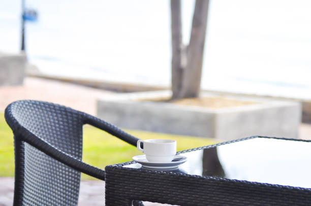 istock chair ,yard and a cup on the table 665698598