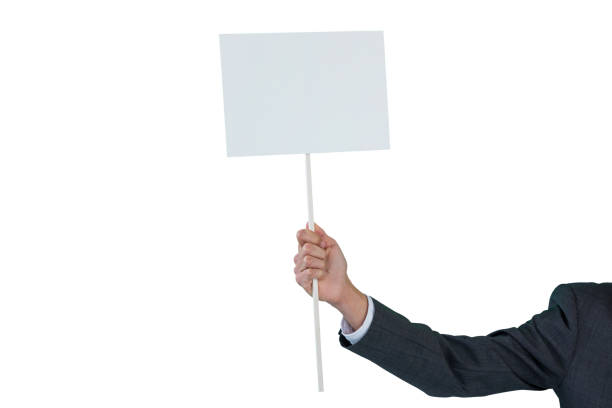 istock Hand of businessman holding blank placard 665702040