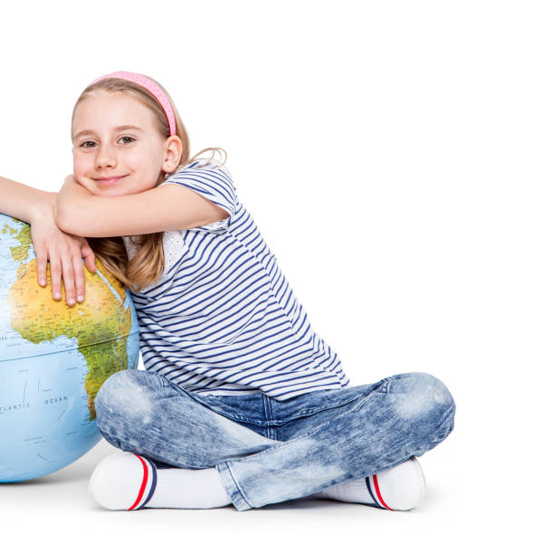 istock Cute little student girl with globe. School Education Concept 665702292