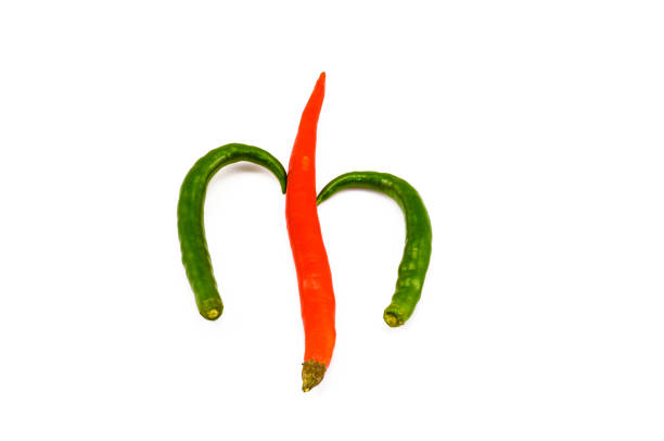 istock Two green and one red chilli on the white background 665702638