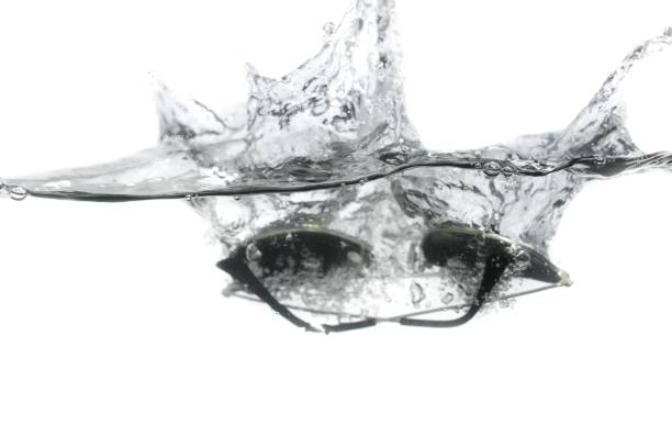 ice cube splashing in water, isolated on white