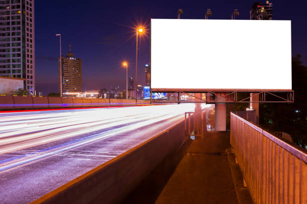 istock Blank billboard on light trails, street and urban in night 665707968