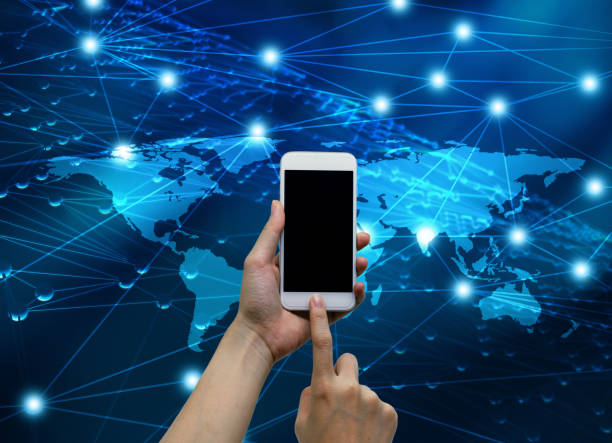 istock Hands touching smartphone with internet connected lines and global map background, social nets and network concept illustration 665721448
