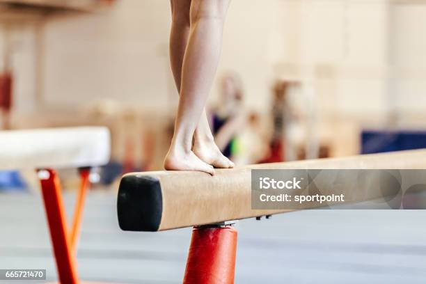 Legs Women Gymnasts Exercises On Balance Beam Stock Photo - Download Image Now - Gymnastics, Balance Beam, Balance