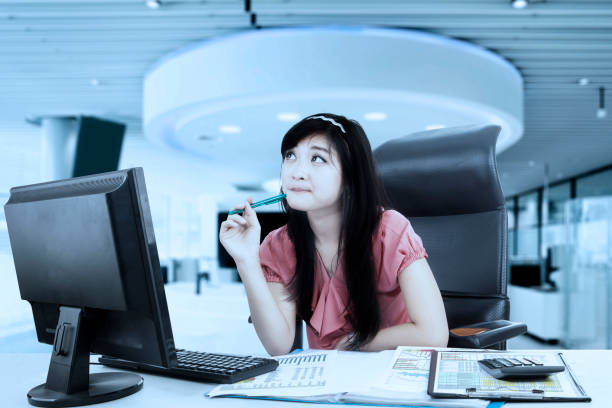 istock Businesswoman looking sideways in the office 665724422