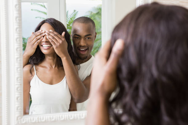 istock Young man covering womans eyes 665730714
