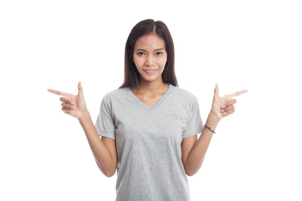 istock Young Asian  woman point to left and right. 665731744