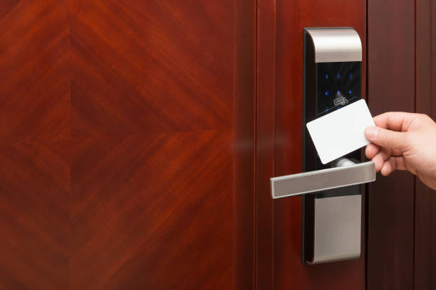 istock electronic door lock opening by an blank security card 665733986