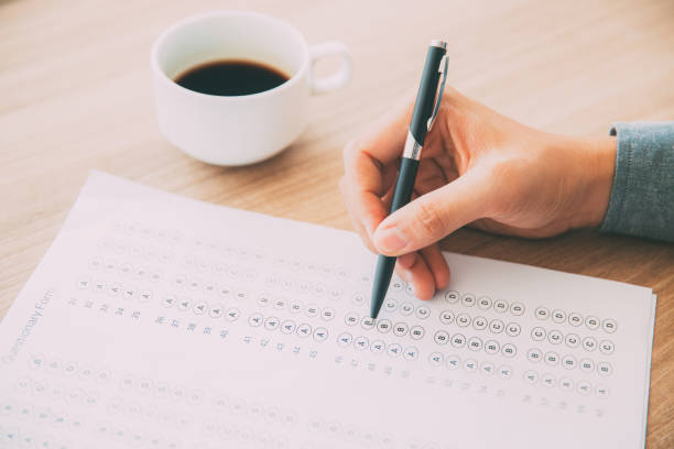 istock Male hand answering questionary form with pen 665736798