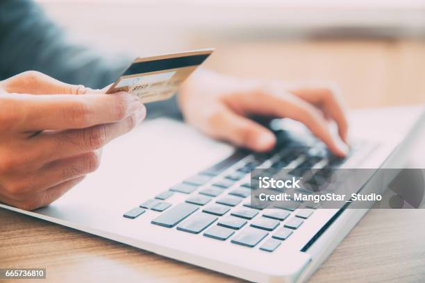 Man Making Online Purchase With Credit Card Stock Photo - Download Image Now - Credit Card, Paying, Making