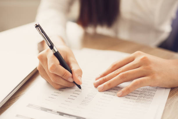 istock Cropped View of Person Working with Document 665736928