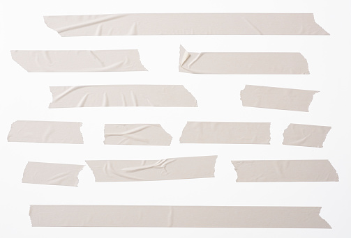 Lots of torn masking tape, isolated on white with clipping path.