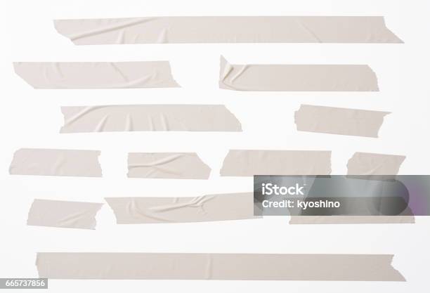Isolated Shot Of Many Torn Masking Tape On White Background Stock Photo - Download Image Now