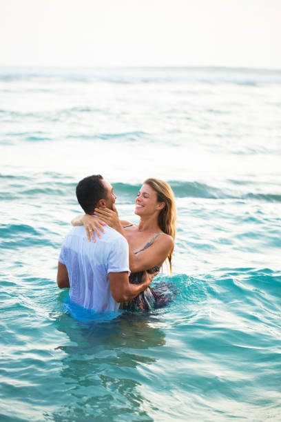 istock Positive couple swimming in clothes 665738066